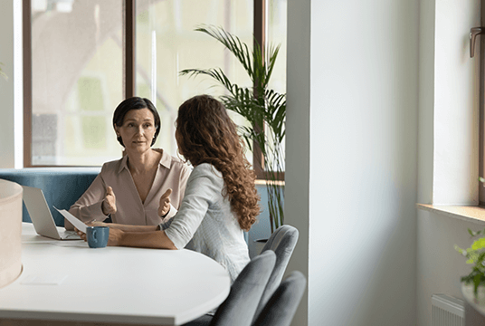 A female HR Manager having a disciplinary hearing with an employee